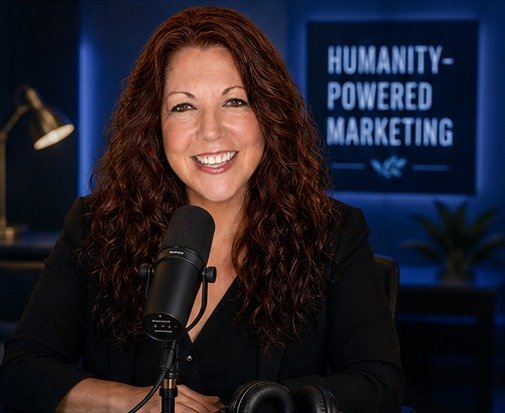 Podcast host Parvene Michaels behind a studio microphone